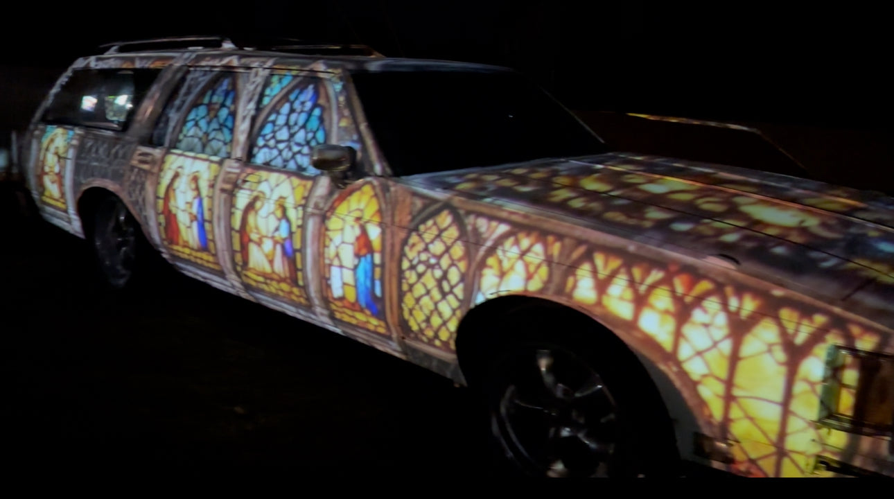 Stained glass projection mapping covering a car