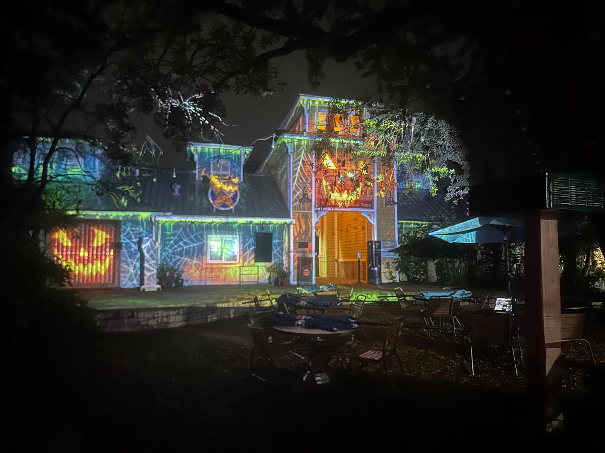 Projection light show on a property at night