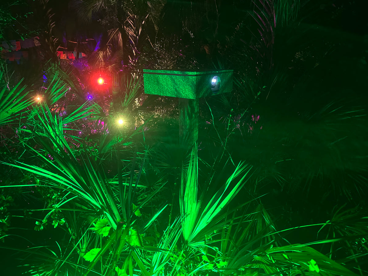 Projection light show on a property at night