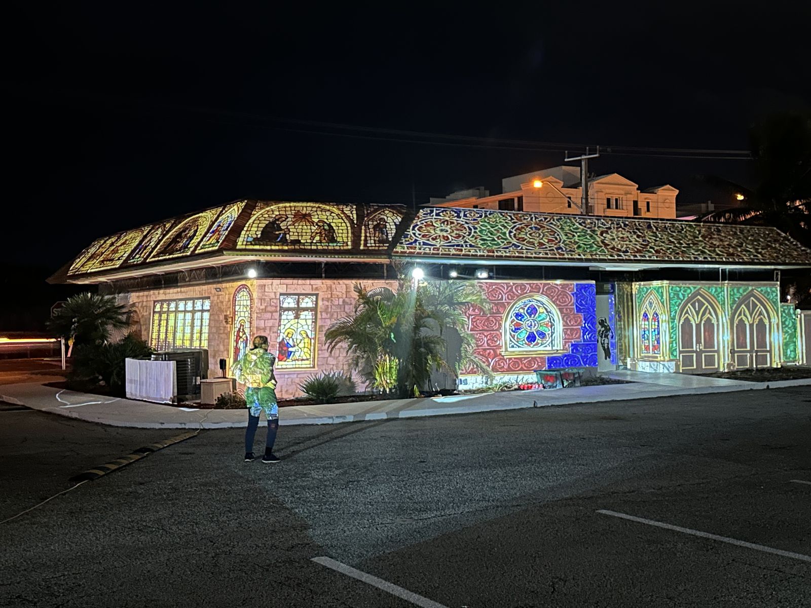 Home lit up at night by The Spacey Box projection show